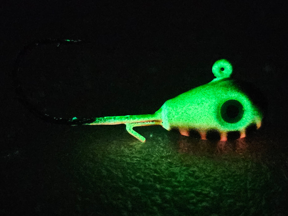 Green Hornet is an anglers dream jig! This fire tiger pattern will whip the walleyes into a feeding frenzy while vertically jigging. It comes in teardrop or round head jig styles. This unique HCL jig features a strong green UV glow & makes it highly visible in low light conditions. If you're wondering what the best walleye jig is...the answer is our Green Hornet - side view.