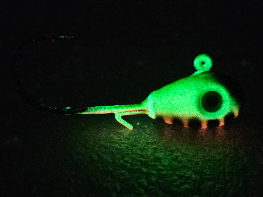 Green Hornet is an anglers dream jig! This fire tiger pattern will whip the walleyes into a feeding frenzy while vertically jigging. It comes in teardrop or round head jig styles. This unique HCL jig features a strong green UV glow & makes it highly visible in low light conditions. If you're wondering what the best walleye jig is...the answer is our Green Hornet - side view.