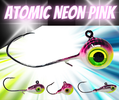Atomic Neon Glow Walleye Jig in Pink – UV glow finish with holographic 3D eyes. Built to last.